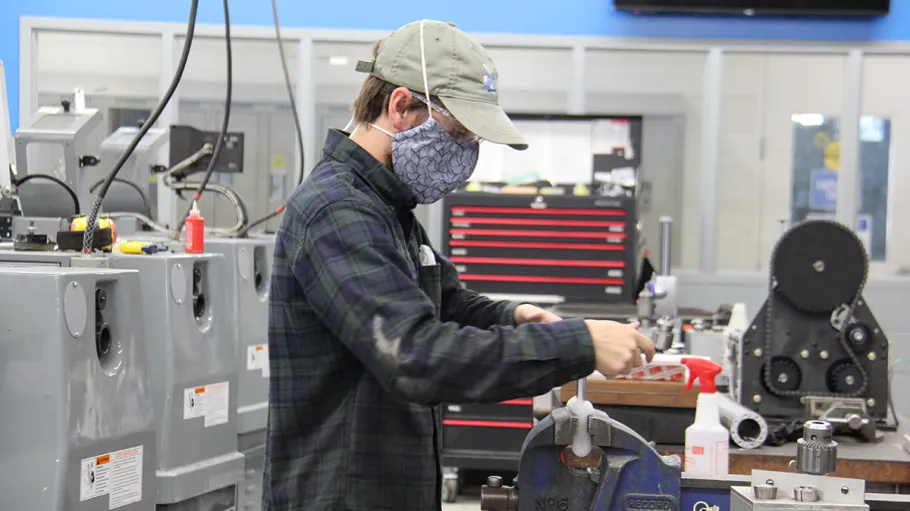 Student working at a machine
