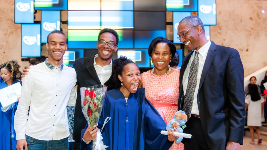 A GBC student celebrate graduating with family and friends