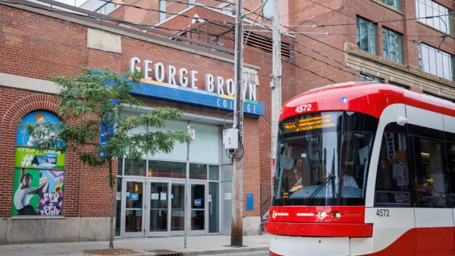 Streetcar passing the entrance of 200 King St. E., St James Campus