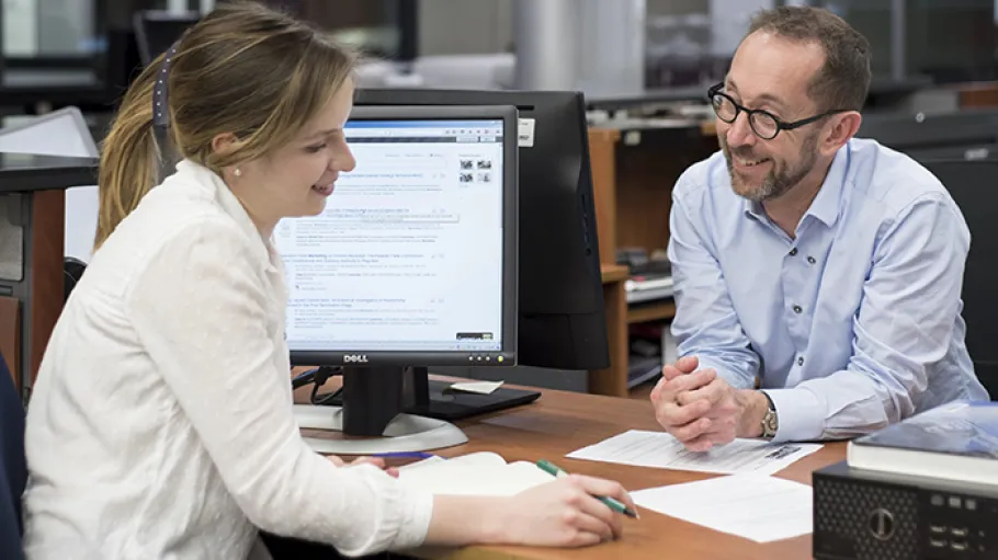 Career Services & Advising staff helping an alumna