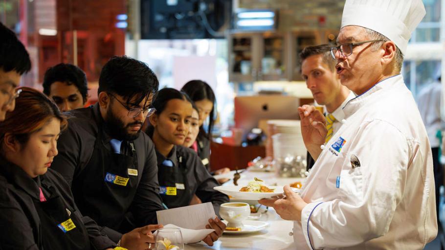 Chef David Wolfman instructing students at The Chefs' House