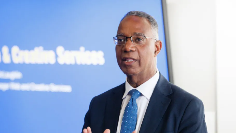 Dr Gervan Fearon speaking at podium