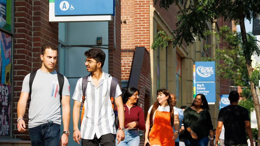 Students walking outside 200 King St. E., St. James Campus