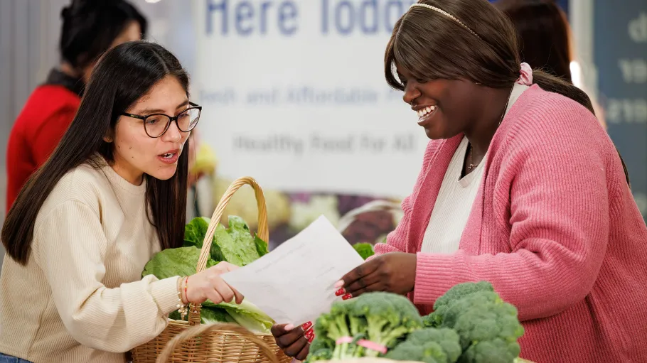 2 Community Worker program students at the Good Food Market