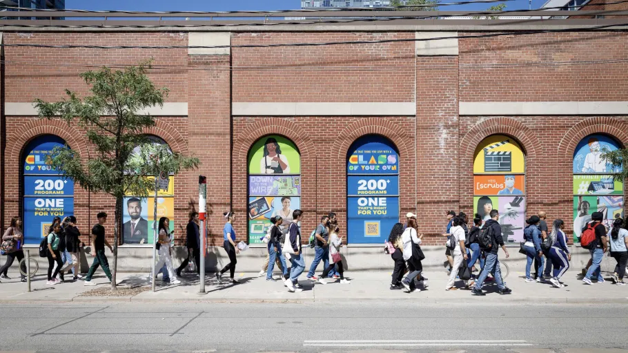 St James campus exterior with students walking