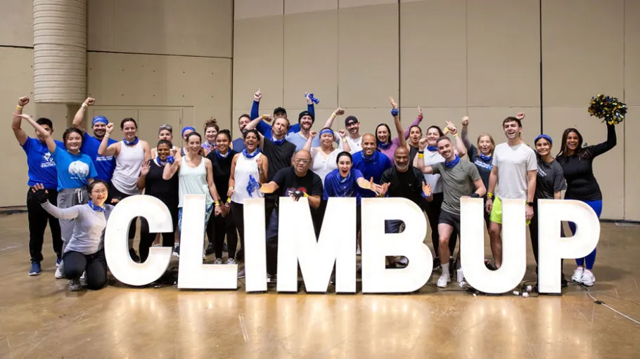 The GBClimbers pose with the CN Tower Climb Up sign