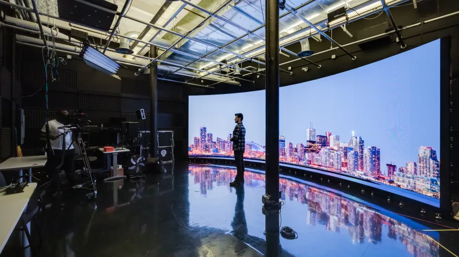 Students from the School of Media & Performing Arts work in the LED media wall studio.