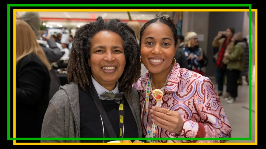 Two Black women from the Do-Tank smile