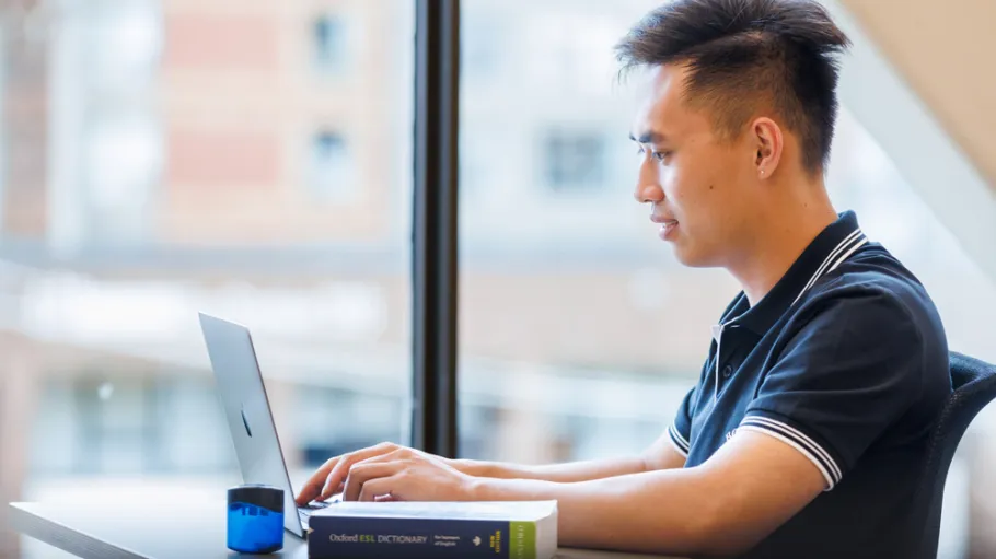 Student working at the laptop