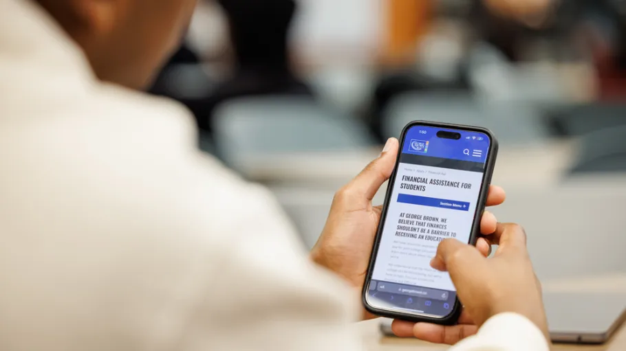 Student is checking information on their cellphone