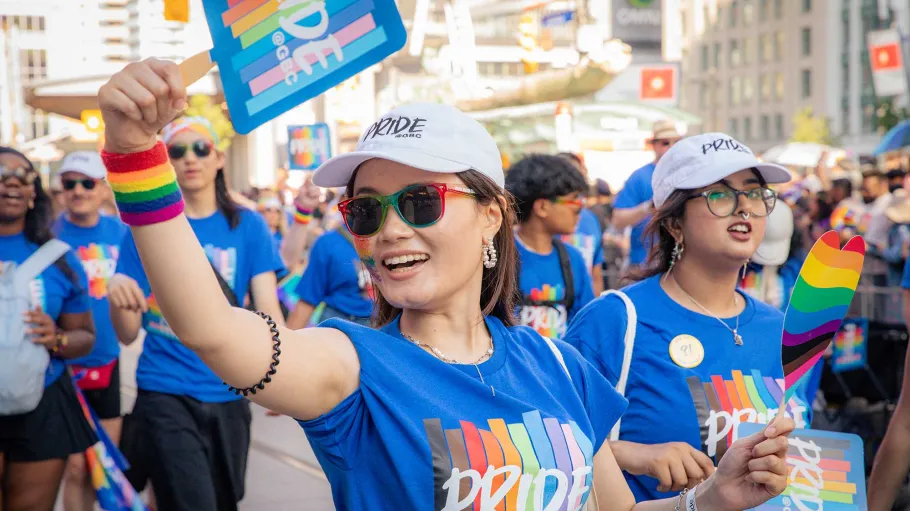 Pride marcher holding up Pride@GBC sign