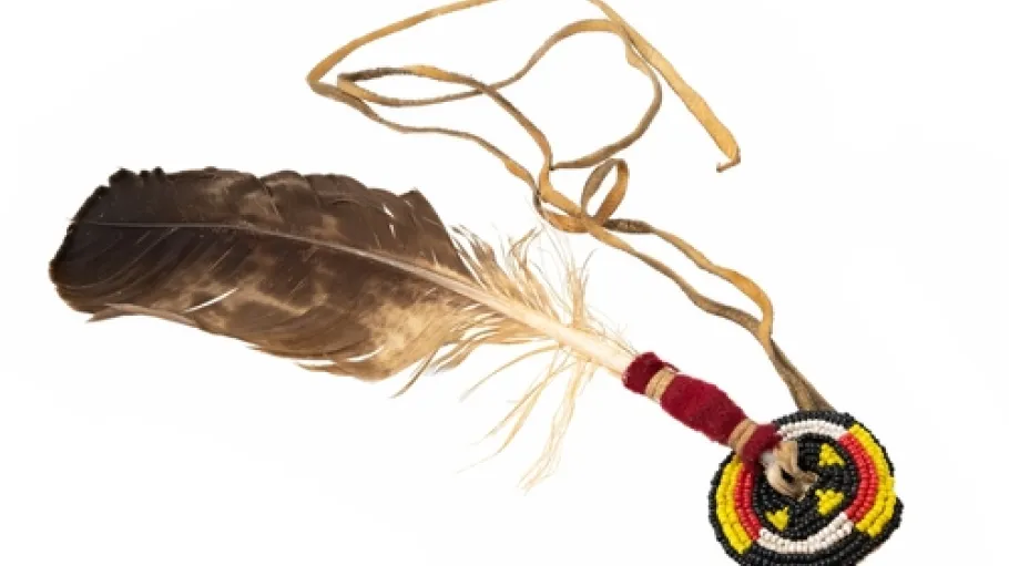Eagle feather beaded as Indian hair accessory isolated on white