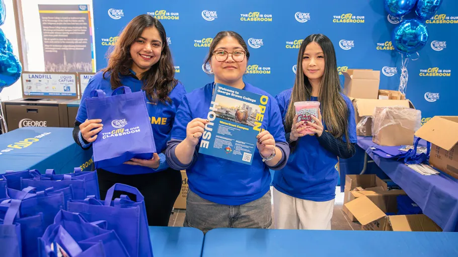 Employees holding viewbooks
