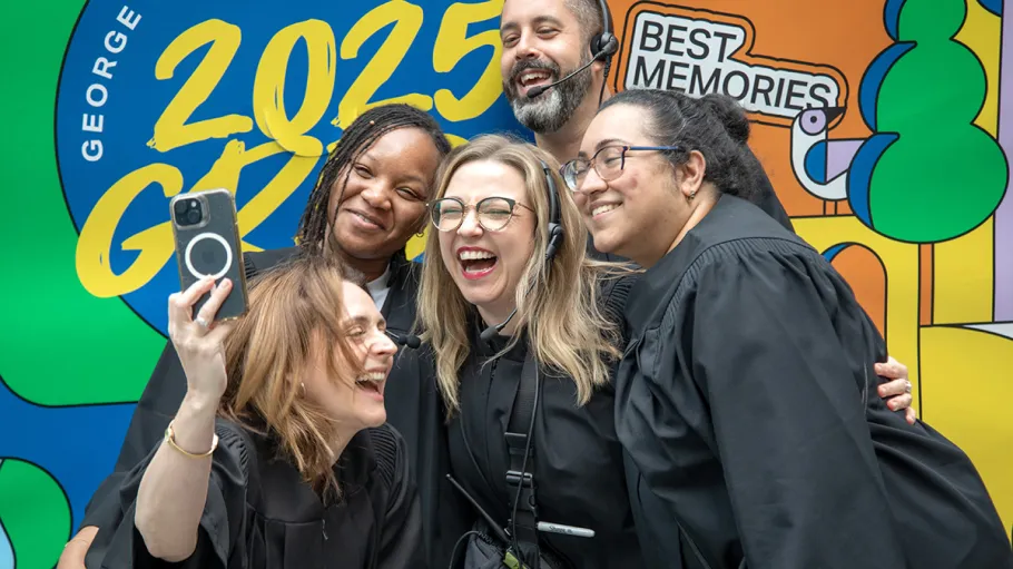 5 employees taking a selfie at 2025 convocation