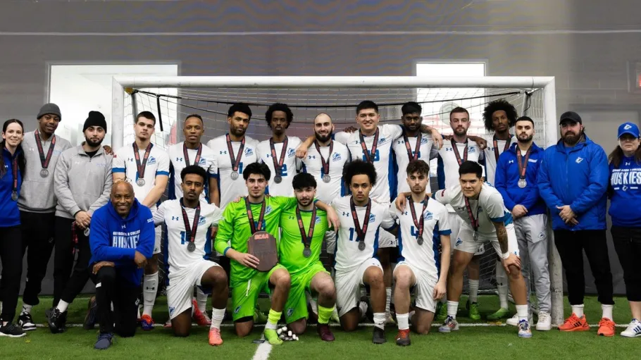 Huskies Mens indoor soccer team 2025 group photo as they win a silver medal