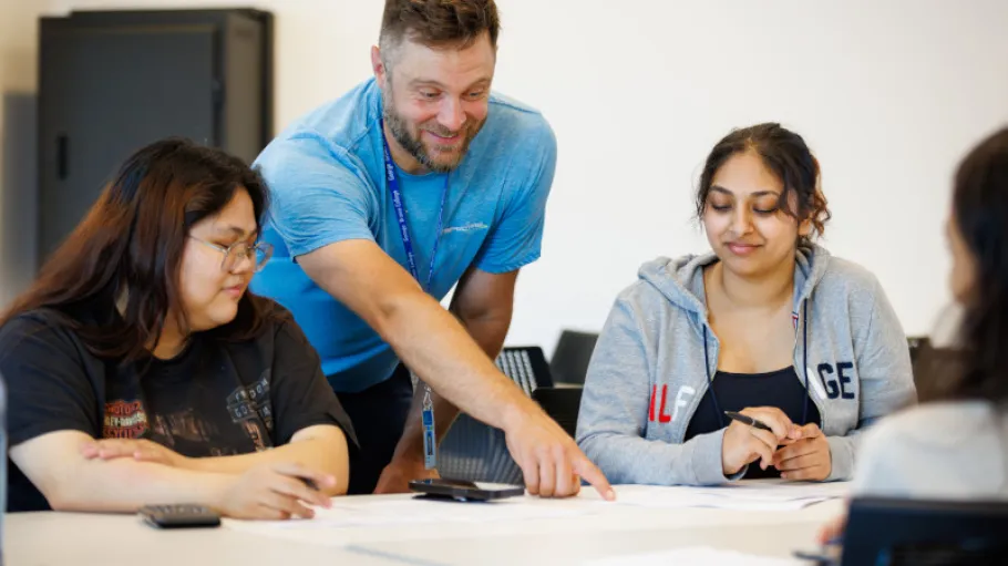An instructor showing something to his students