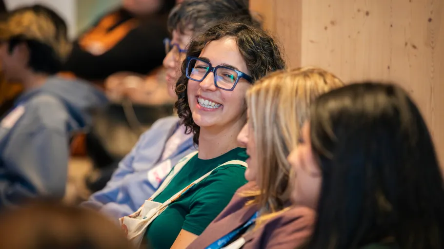 A guest at the Mental Health Conference smiles 