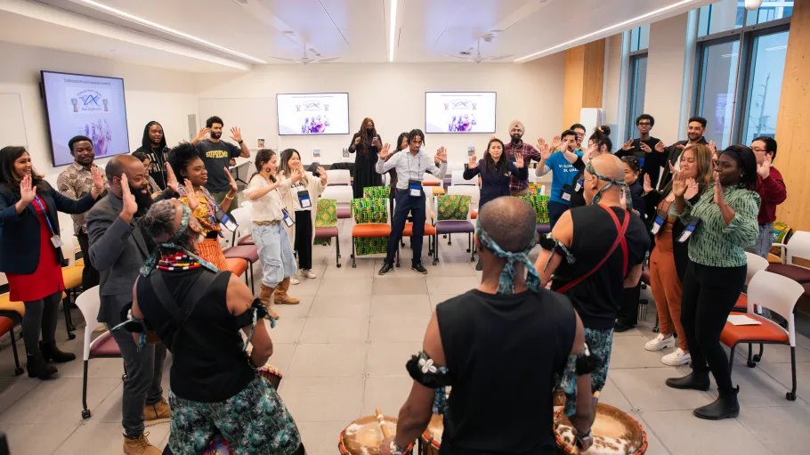 Mental Health Conference participants engage in drumming activity
