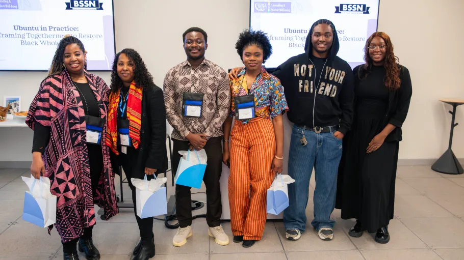 Presenters at the Mental Health Conference pose with thank you bags
