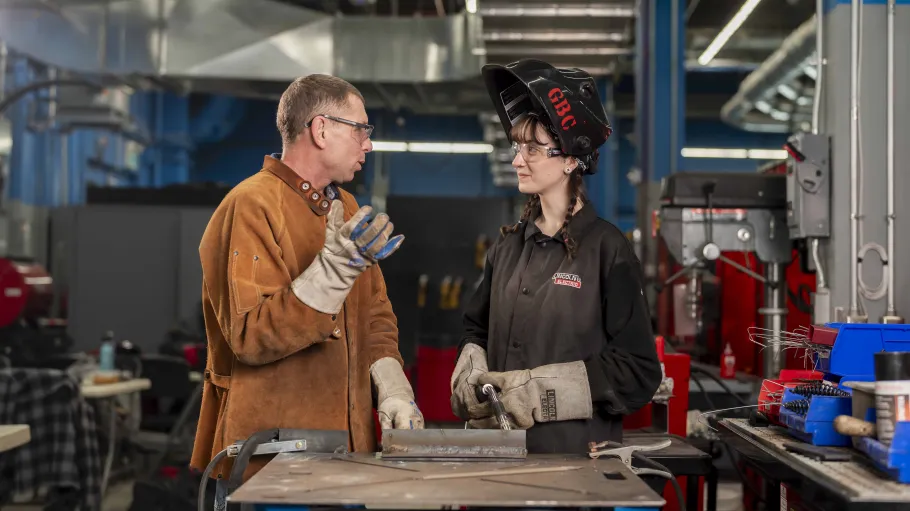 Instructor and student in the welding lab.