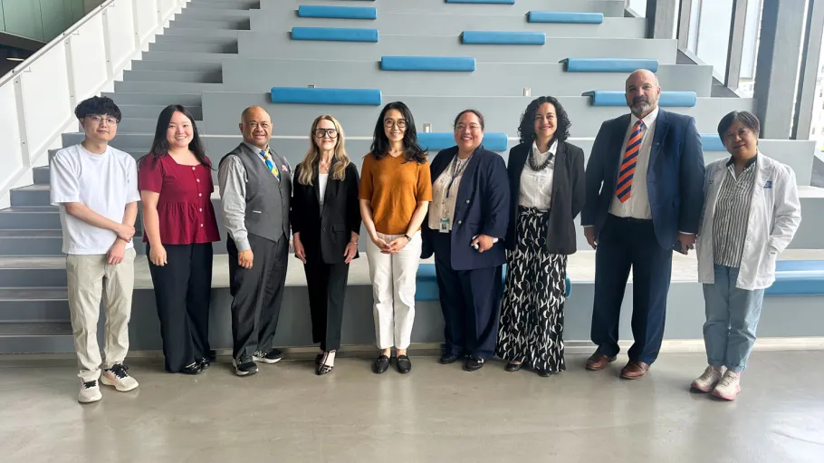 MP Maggie Chin poses for a group photo with Health Sciences staff and faculty in one of Waterfront Campus's learning landscapes.