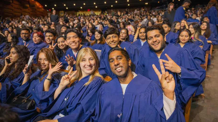 2026 graduates smile and pose at the Convocation ceremonies at Meridian Hall.
