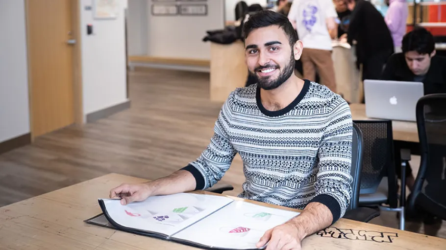 Design Student looking at a portfolio