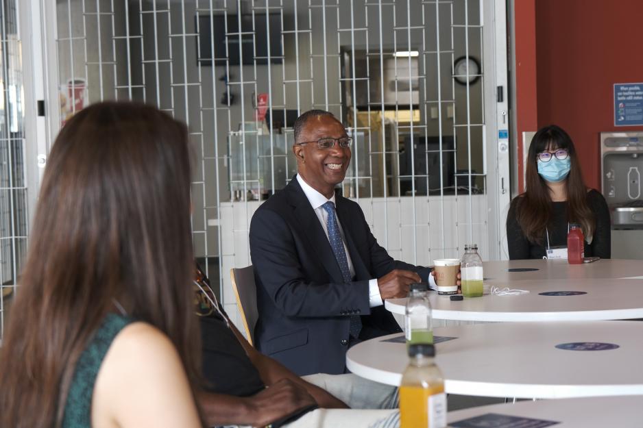 A photo of Dr. Gervan Fearon meeting students
