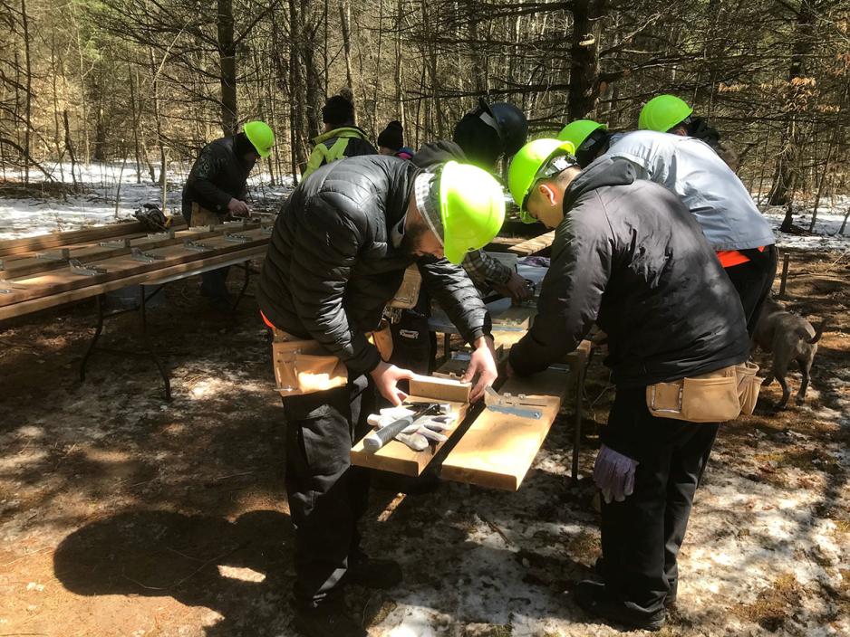 Construction Craft Worker students building a cabin