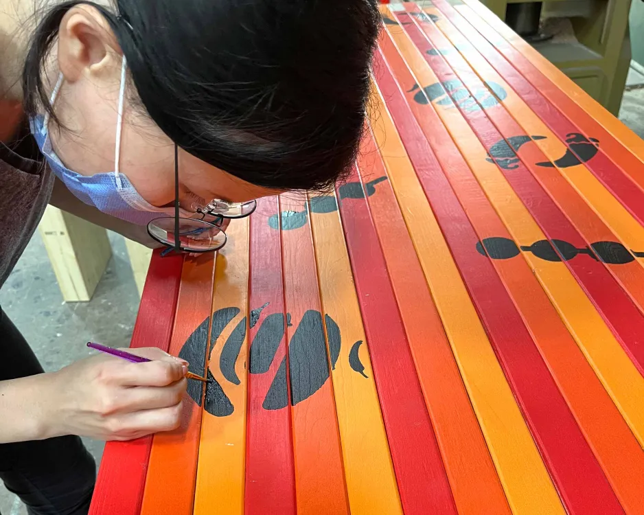 Graphic Design student working on Smorgasburg Toronto tables
