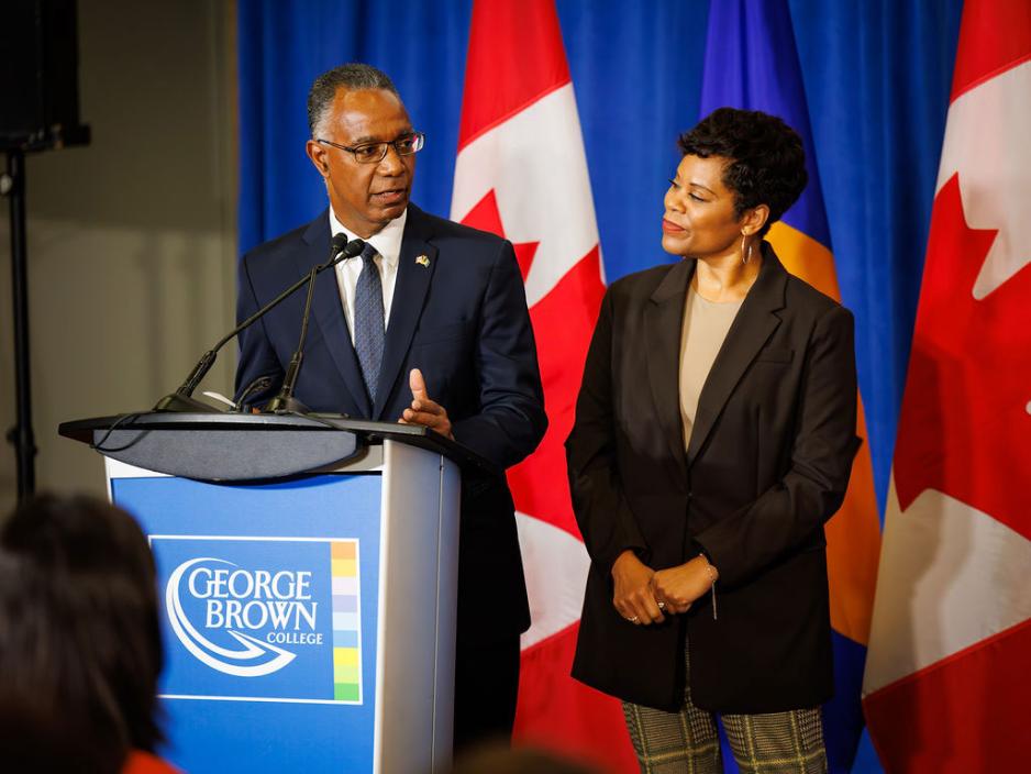 Dr. Gervan Fearon standing next to federal minister Marci Ien
