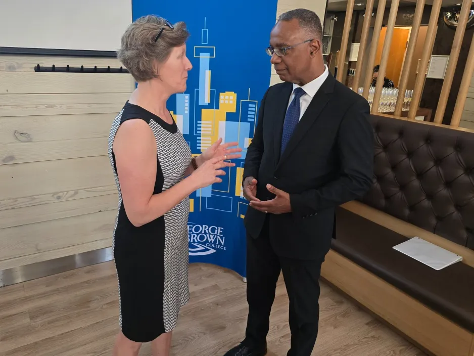 Karine Morin and Dr. Gervan Fearon chat at the opening reception for the 94th Congress of the Humanities, hosted at George Brown College