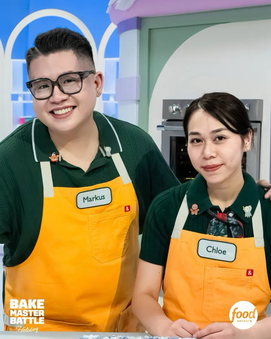 Chef Markus Elegino and alumna Chloe Nguyen on Food Network's Bake Master Battle television show, wearing green shirts, and yellow aprons