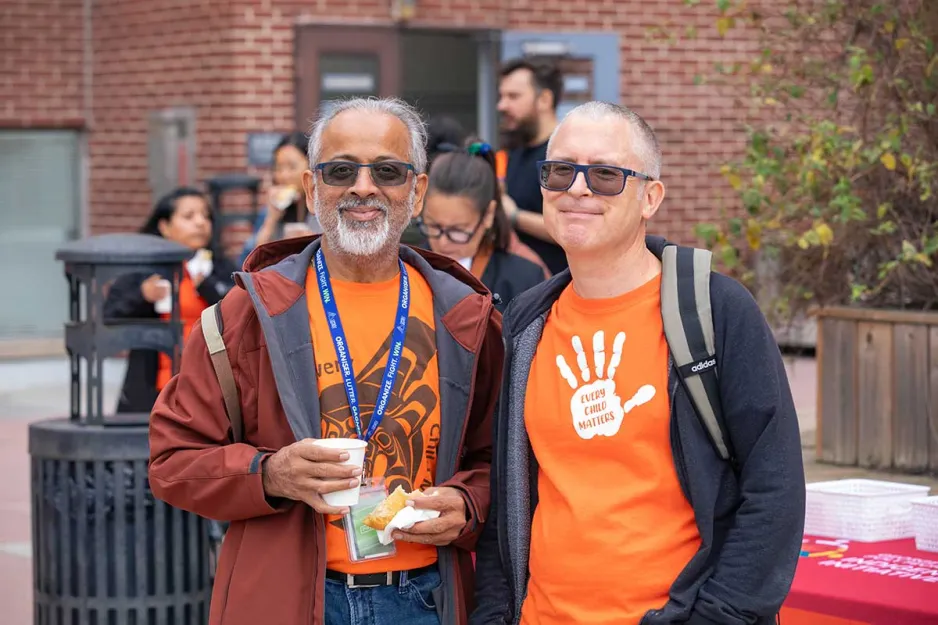 People gatehred at an Orange Shirt Day event