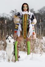 Model 2 wearing fashion from Remix competition posing with a wolf.