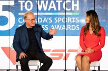 Keith Pelley sits on stage at the 5 to Watch event chatting with the host