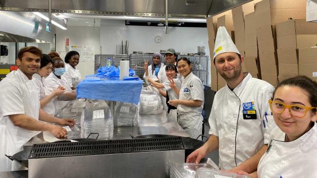 Chef School student volunteers packaging Second Harvest food donations