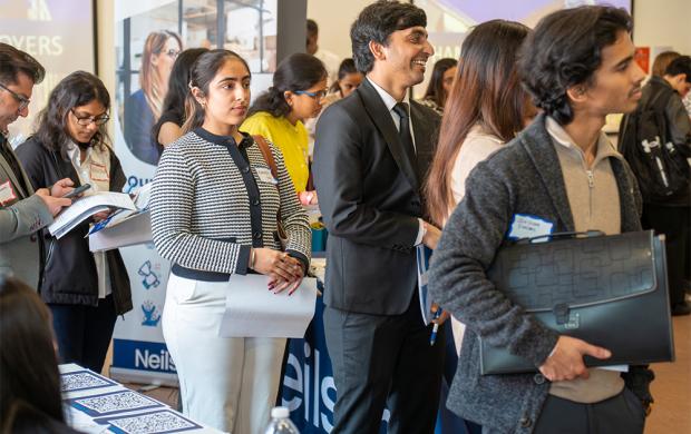 students waiting to register for career fair