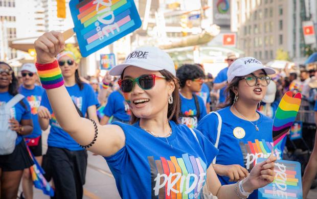 Pride marcher holding up Pride@GBC sign
