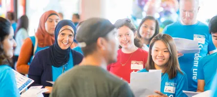 Students taking part in an orientation session led by an employee.