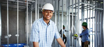 Male construction student hero shot on site.