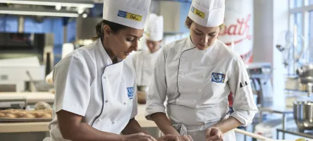 Baking students working together in the kitchen.