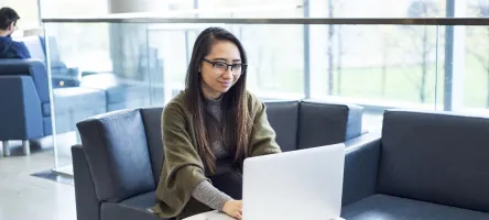 female student using laptop