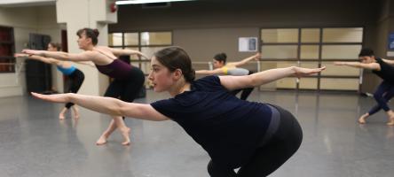 Students practicing dance during a class in a studio