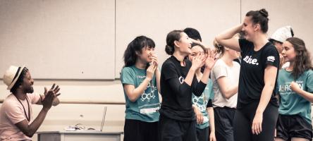 group of dance students laughing