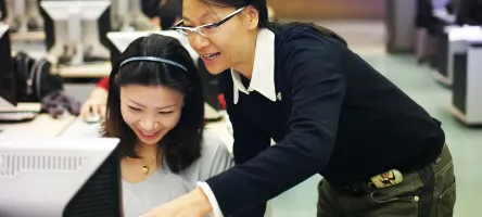 Jewellery Arts professor and student looking at designs on a computer