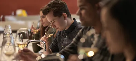 Student smelling wine