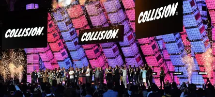 Large group of people on stage at the Collision conference, June 2022