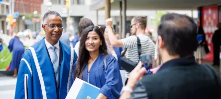 Dr Gervan Fearon with a student at convocation