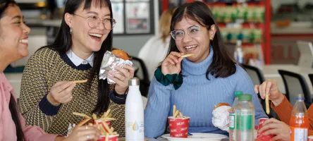 Students eating in a campus food court